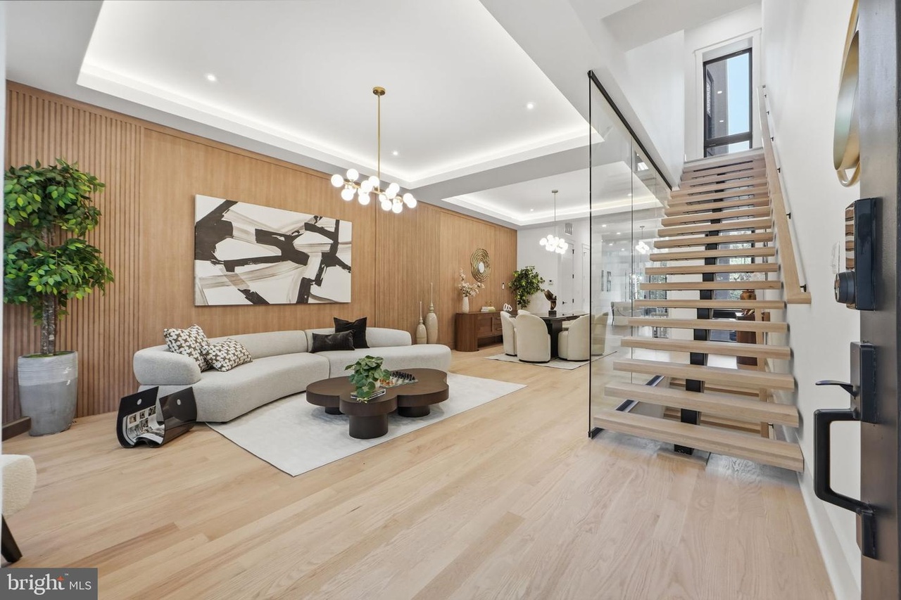 Interior Trim — Custom Wood Slatted Wall Paneling, Curved Sofa & Floating Glass Staircase