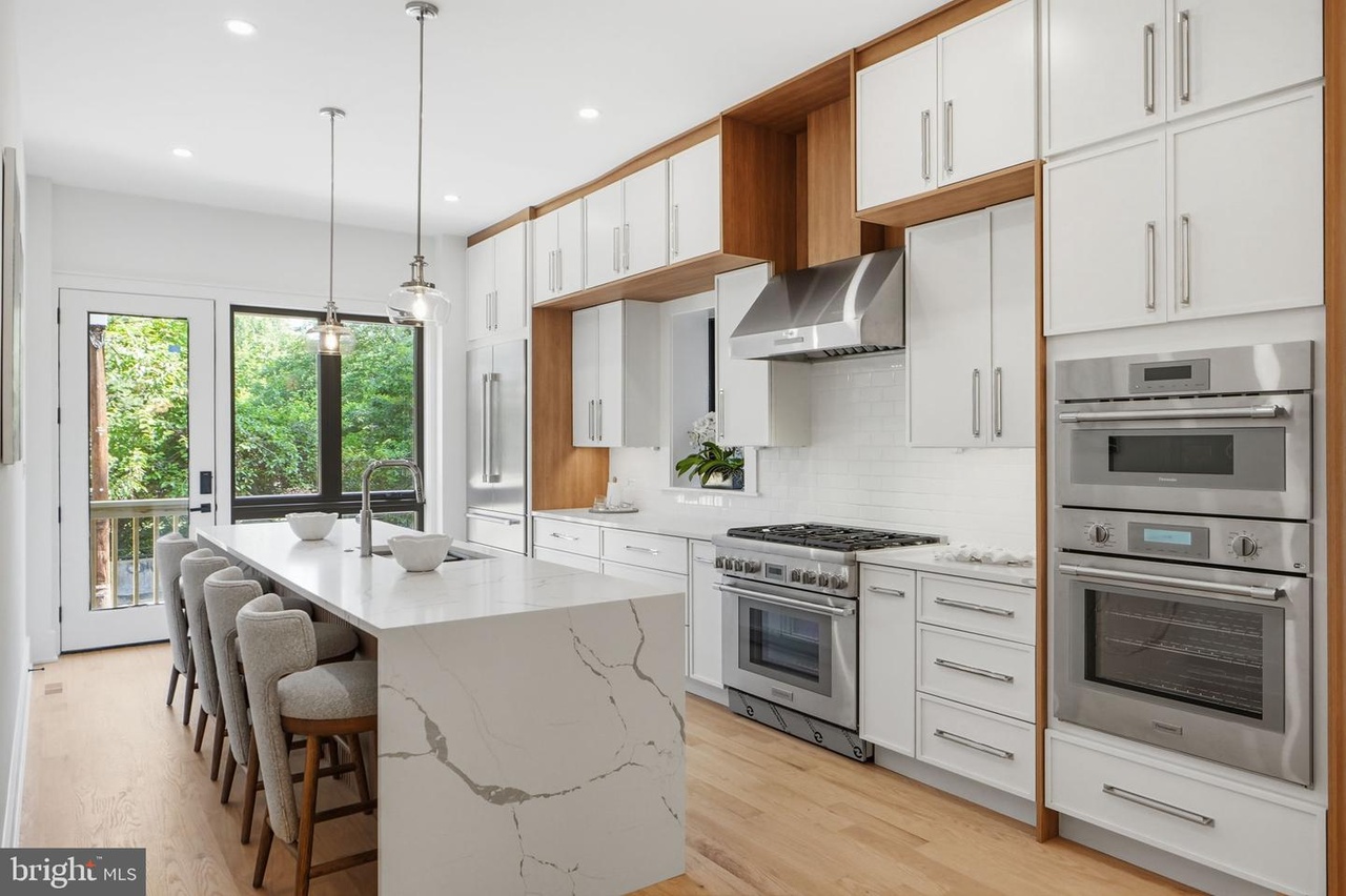 Chef-Grade Luxury Kitchen — Waterfall Quartz Island, Custom Cabinetry, Double Oven